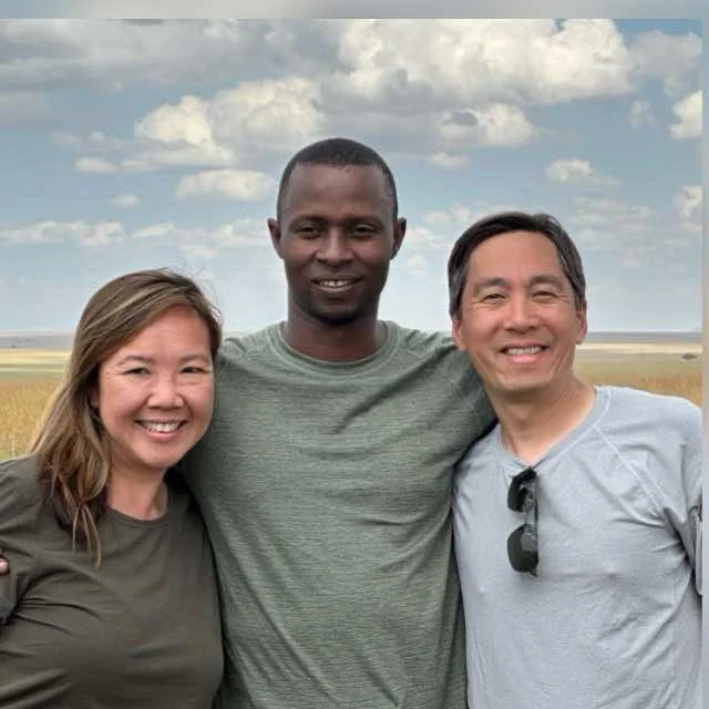 Professional safari guide and photographer Lucas spotting a lion from a vehicle in Tanzania.